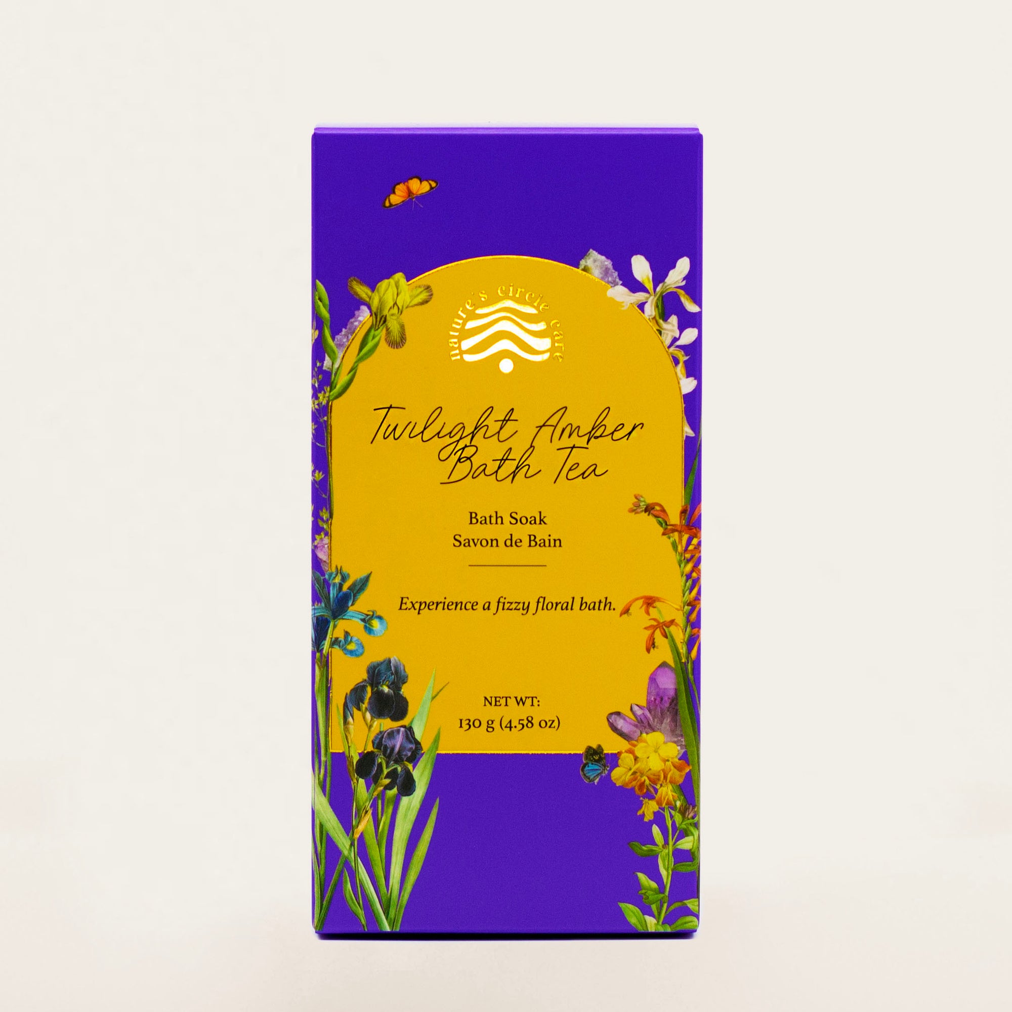 Beautiful packaging of Nature Circle Care's 'Twilight Amber Bath Tea' bath salt, featuring a purple box with floral illustrations and a bold yellow label that reads 'Experience a fizzy floral bath.' 130g (4.58 oz). Perfect for a luxurious and aromatic bath experience.