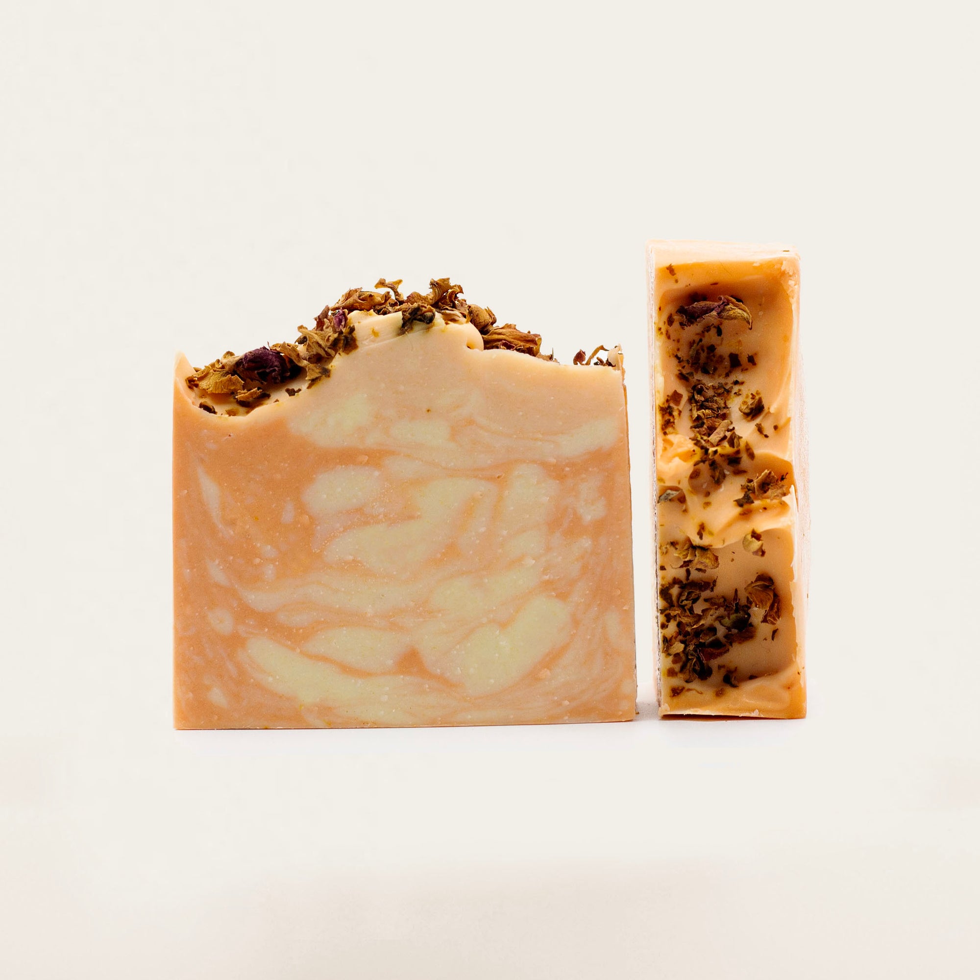 Handcrafted goat milk soap with palm oil, castor oil, goat milk powder, and orange mica powder, scented with orange creamsicle fragrance oil for a refreshing and nourishing cleanse.