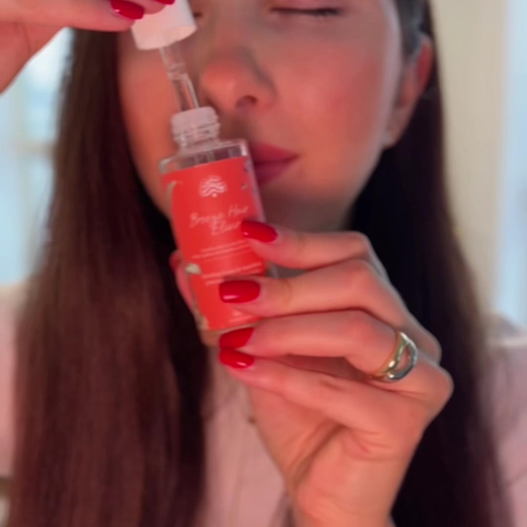 Post Wash Hair Elixir application for taming frizzy hair.